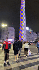 Buenos Aires Obelisco displays colorful light show during evening