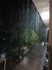 Heavy rainstorm saturates Lhokseumawe, Indonesia streets at night