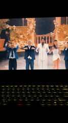 Milan resident uses backlit laptop viewing music video, logo animation
