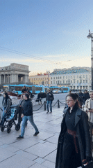 Pedestrians gather near horse carriage in Saint Petersburg