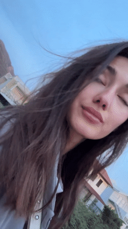 Woman and curly-haired dog share quiet moments in Sutomore