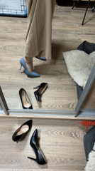 Woman tries on clothes in Saint Petersburg mirror
