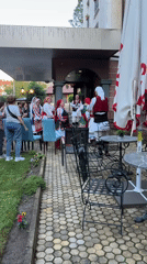 Traditional folk dancers perform in Kyustendil Bulgaria courtyard