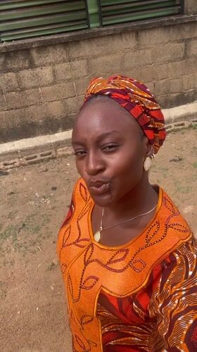 Woman photographed around residential Barakin Akawo, Nigeria neighborhood
