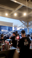 Outdoor music festival draws crowds, bartenders serve audience