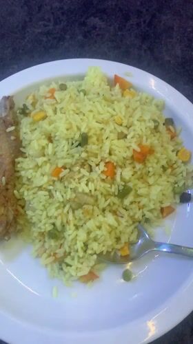 Meal of yellow rice and vegetables documented in Enugu