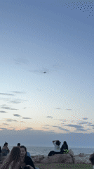 Casual beach gathering observed in Tel Aviv shoreline area