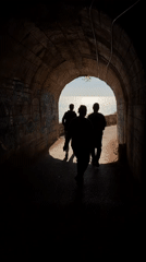Three people exit graffitied tunnel in Montenegro village