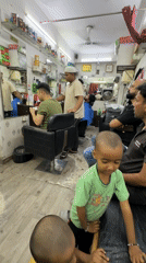 Routine barbershop activities documented in Delhi during evening hours