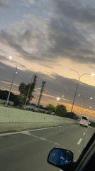 Evening highway commute captured during sunset hours