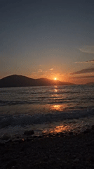 Sunset recorded over calm waters at Albanian beach