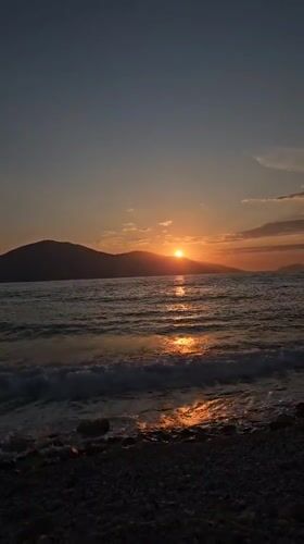 Sunset recorded over calm waters at Albanian beach
