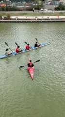 Five kayakers paddle down green river in Tel Aviv