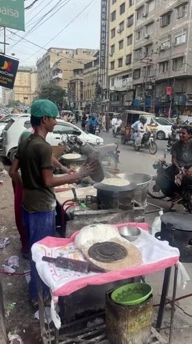 Street food and loaded motorbike scenes from midday Karachi