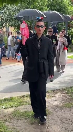 Black suits, toy cars, and bubble guns along St. Petersburg streets