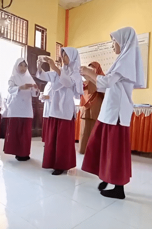 Students perform synchronized dance in Indonesian classroom