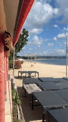 Kampoeng Seafood's beachfront tables and swing, Jimbaran Bay