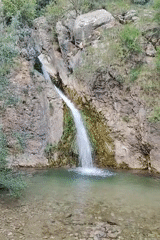Woman visits scenic waterfall in Rafailovići, Montenegro