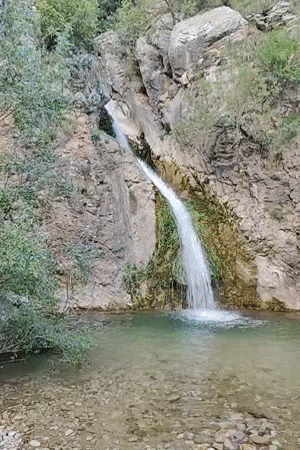 Woman visits scenic waterfall in Rafailovići, Montenegro
