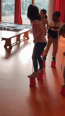 Children practice balance activities at La Fouillouse gymnasium