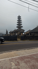 Tourist documents temple views and local shops in Bali