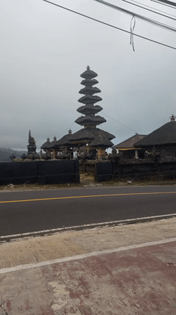 Tourist documents temple views and local shops in Bali