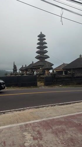 Tourist documents temple views and local shops in Bali