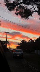 Vivid sunset illuminates residential street in Bulli, Australia
