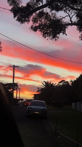 Vivid sunset illuminates residential street in Bulli, Australia
