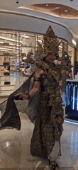 Traditional Balinese procession performs in Denpasar shopping mall