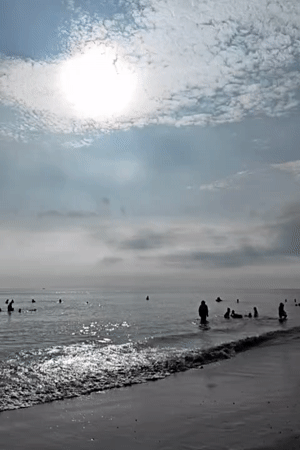 Families enjoy beach day in Lhokseumawe, Indonesia