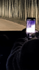 Vehicle travels dirt road at night in Belarus