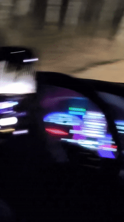 Vehicle travels dirt road at night in Belarus