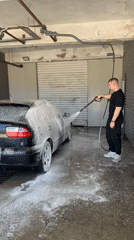 Man washes cars at commercial facility in Shumen, Bulgaria