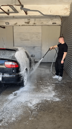 Man washes cars at commercial facility in Shumen, Bulgaria
