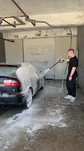 Man washes cars at commercial facility in Shumen, Bulgaria