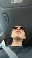 Woman singing while driving in San Antonio late night