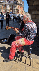 Cambridge street scenes: busker, cosmetics, casual dining captured
