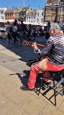 Cambridge street scenes: busker, cosmetics, casual dining captured