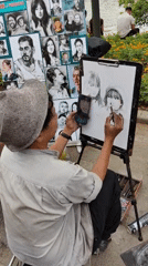 Street artists sketch portraits by Hanoi's Hoan Kiem Lake