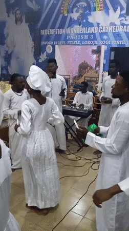 White-robed congregants gather for religious ceremony in Lokoja, Nigeria