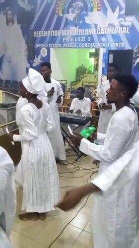 White-robed congregants gather for religious ceremony in Lokoja, Nigeria
