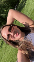 Woman relaxes on park benches in sunny Shcherbinka
