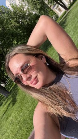 Woman relaxes on park benches in sunny Shcherbinka
