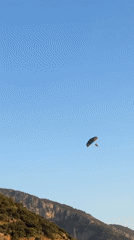 Paragliders land on Fethiye beaches during afternoon operations