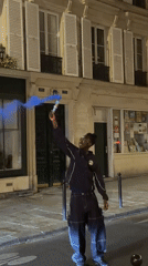 Young man in track jacket observed on Paris street