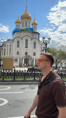 Man walks past Cathedral of Christ the Saviour in Moscow