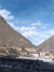 Tourists explore ancient Ollantaytambo ruins in Peru's Sacred Valley