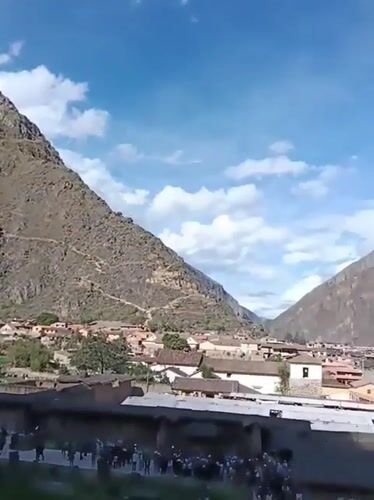 Tourists explore ancient Ollantaytambo ruins in Peru's Sacred Valley