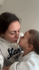 Mother and daughter share quiet moment at home in Varna